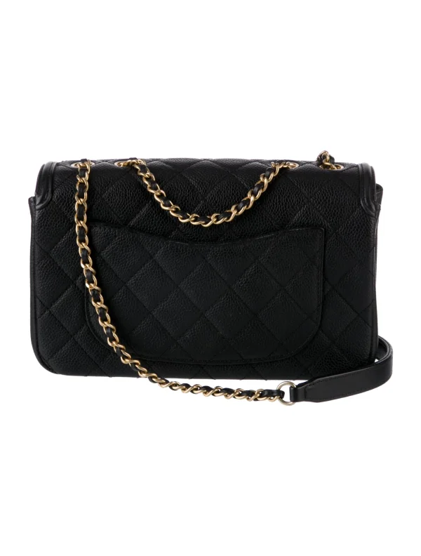 a black handbag with gold chains