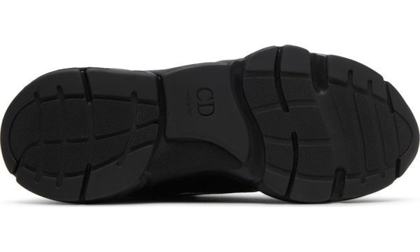 a black shoe with a white background