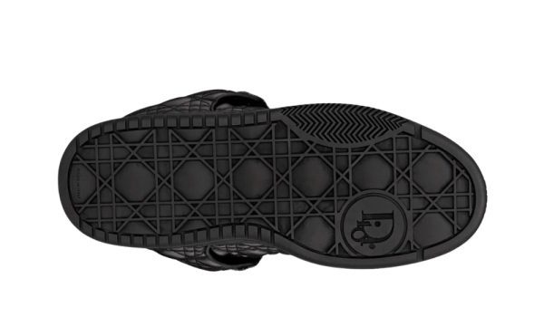 a black shoe with a pattern on the bottom